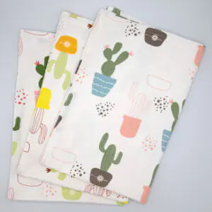 Thorny issue design set of three tea towels fanned from hem and tassel