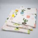 Thorny issue design set of three tea towels folded from hem and tassel