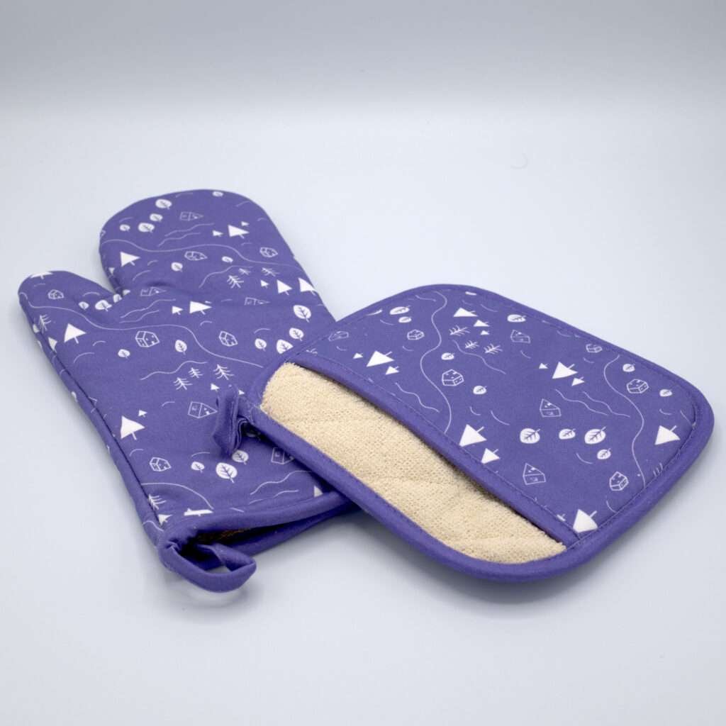 Tiny countryside design mitt and pocketed hot pad in purple from hem and tassel