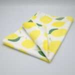amalfi lemons design tea towel folded from hem and tassel