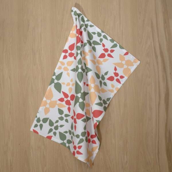 celebration design hanging tea towel in pink from hem and tassel