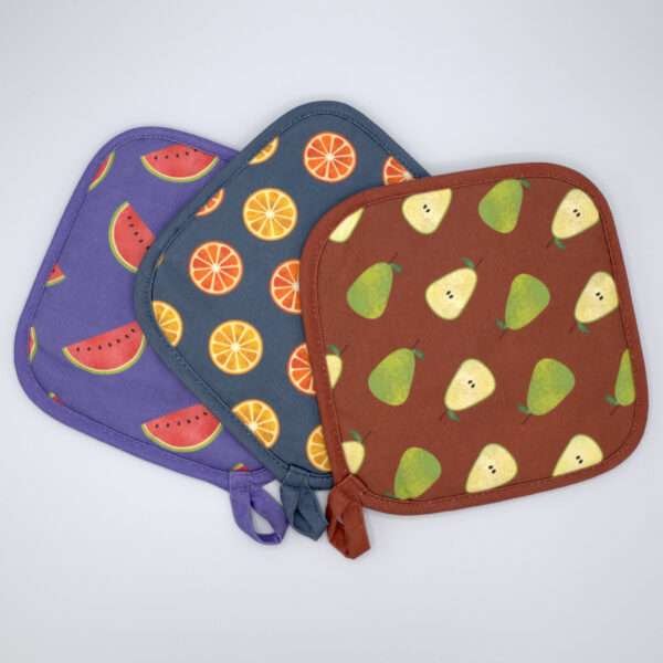 faded fruit pot holders fanned out from hem and tassel
