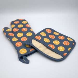 faded orange design mitt and pocketed hot pad from hem and tassel