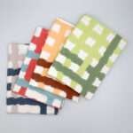 jute impossible checked design four tea towels fanned from hem and tassel