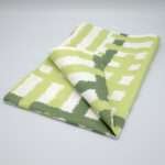 jute impossible checked design mint tea towel folded from hem and tassel