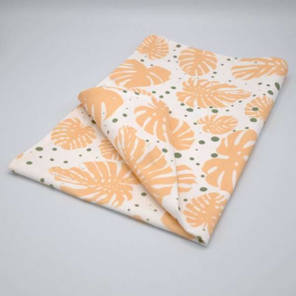 monstera monster-ah design of kitchen towel in buff and turf from hem and tassel
