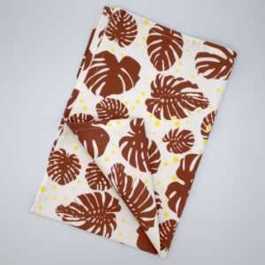 monster ah design clay and yellow tea towel flat folded from hem and tassel