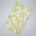 monster ah design mint and clay tea towel flat folded from hem and tassel