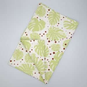 monster ah design mint and clay tea towel flat folded from hem and tassel