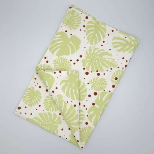 monster ah design mint and clay tea towel flat folded from hem and tassel