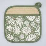 monster ah design pocketed pot holder in turf. kitchen accessories from hem and tassel