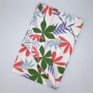 pollen up design tea towel in pink flat folded from hem and tassel