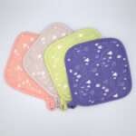 tiny countryside design pot holders fanned out from hem and tassel