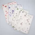 tiny countryside design tea towels fanned in four colors from hem and tassel