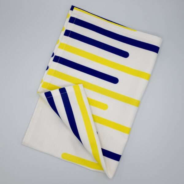 yellow piano H design tea towel flat folded from hem and tassel