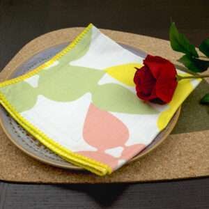 Celebration design Blush Napkin LS on Green Kidney Bean Cork placemat from hem and tassel