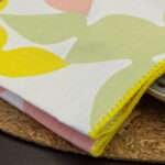 Celebration design Napkin in blush close up]