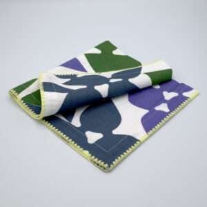 Celebration design dinner napkin in purplefolded from hem and tassel