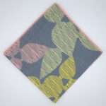 Celebration design dinner napkin in winter flat folded from hem and tassel