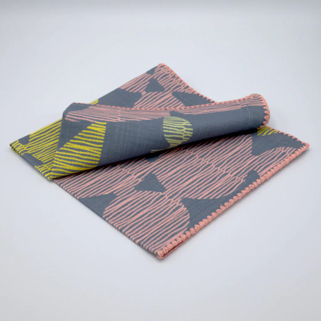Celebration design dinner napkin in winter folded from hem and tassel