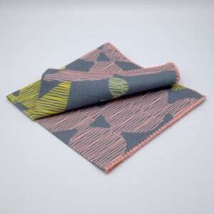 Celebration design dinner napkin in winter folded from hem and tassel