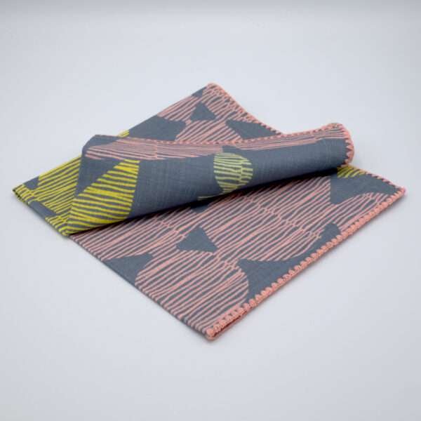 Celebration design dinner napkin in winter folded from hem and tassel
