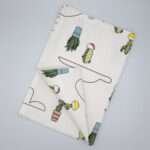 Clouds and cactus design tea towel flat folded from hem and tassel