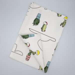 Clouds and cactus design tea towel flat folded from hem and tassel
