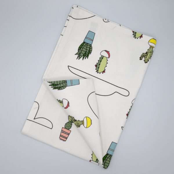 Clouds and cactus design tea towel flat folded from hem and tassel