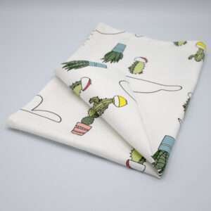 Clouds and cactus design tea towel folded from hem and tassel
