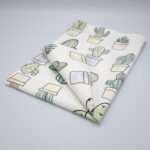 Desert Haze design tea towel folded from hem and tassel