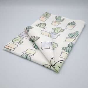 Desert Haze design tea towel folded from hem and tassel