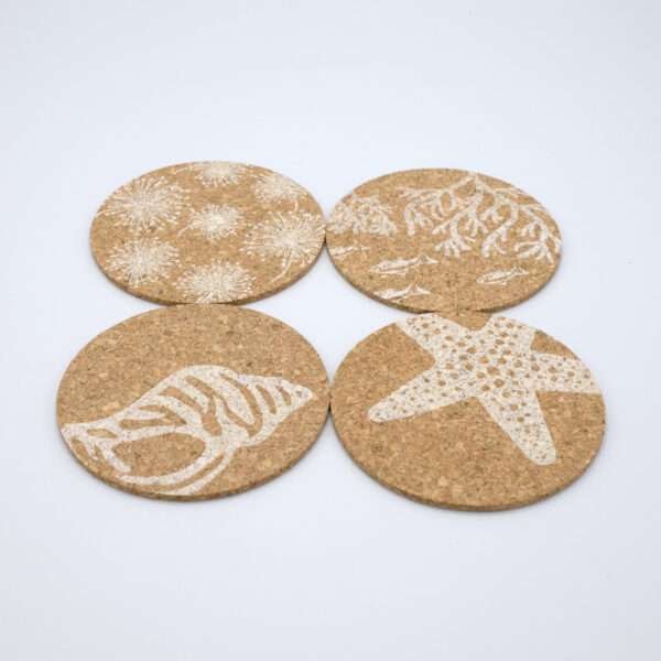 Home by the sea design cork coasters set of four fanned out from hem and tassel