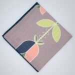 Lip TuLip design dinner napkins in oil flat folded from hem and tassel