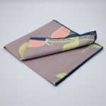 Lip TuLip design dinner napkins in oil folded from hem and tassel