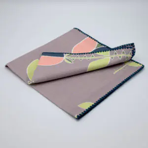 Lip TuLip design dinner napkins in oil folded from hem and tassel