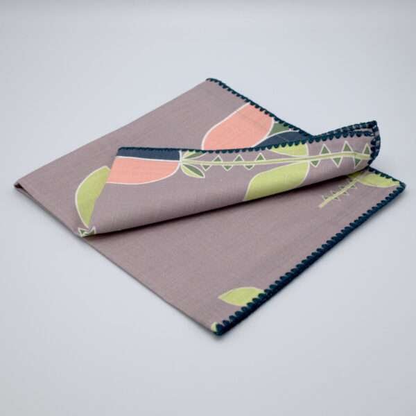 Lip TuLip design dinner napkins in oil folded from hem and tassel