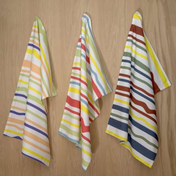 Not straight broad design set of three hanging tea towels from hem and tassel