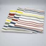 Not straight design set of three bold tea towels folded from hem and tassel