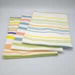 Not straight design set of three mild tea towels folded from hem and tassel