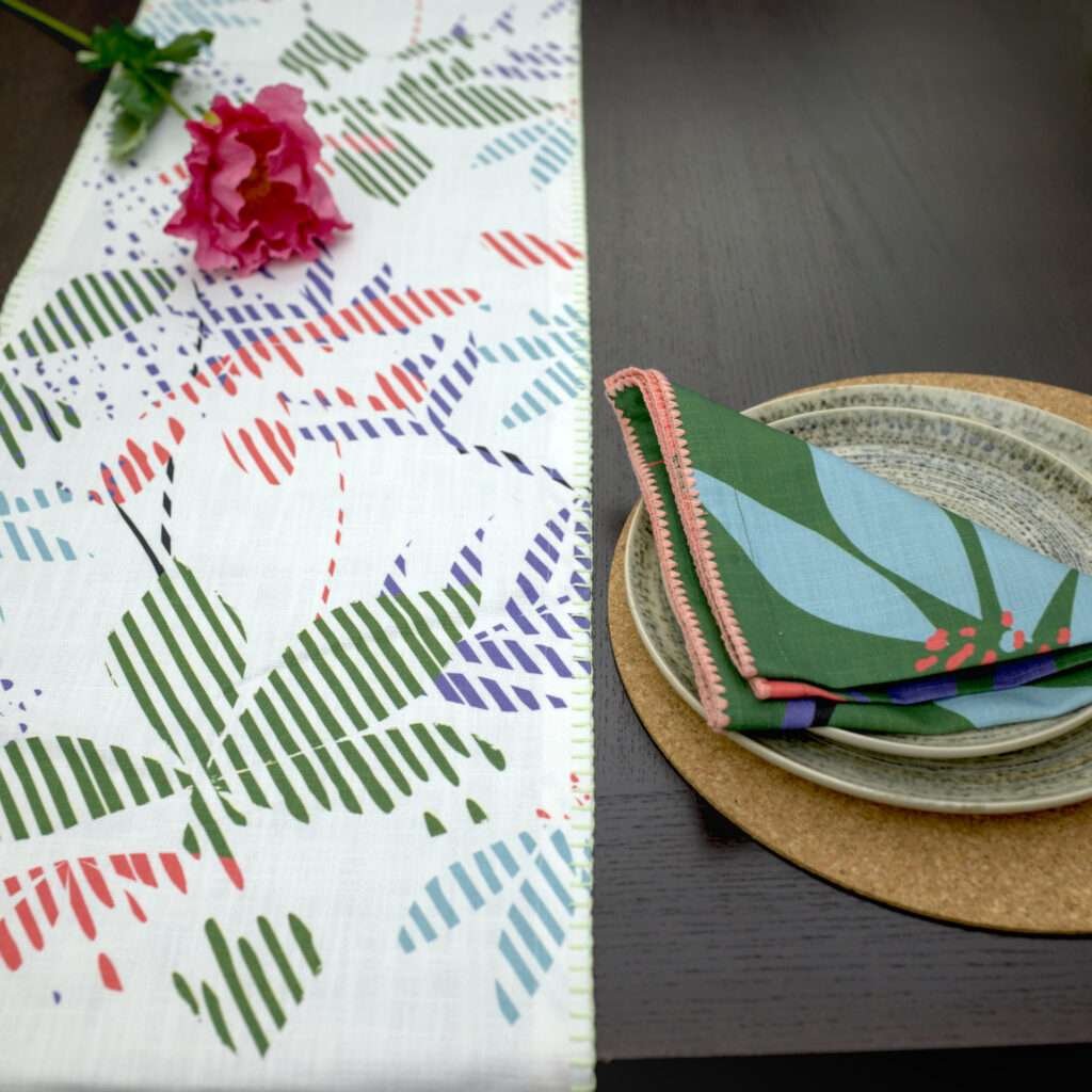 Pollen up design Dinner Napkin in pink with blue table runner LS from hem and tassel