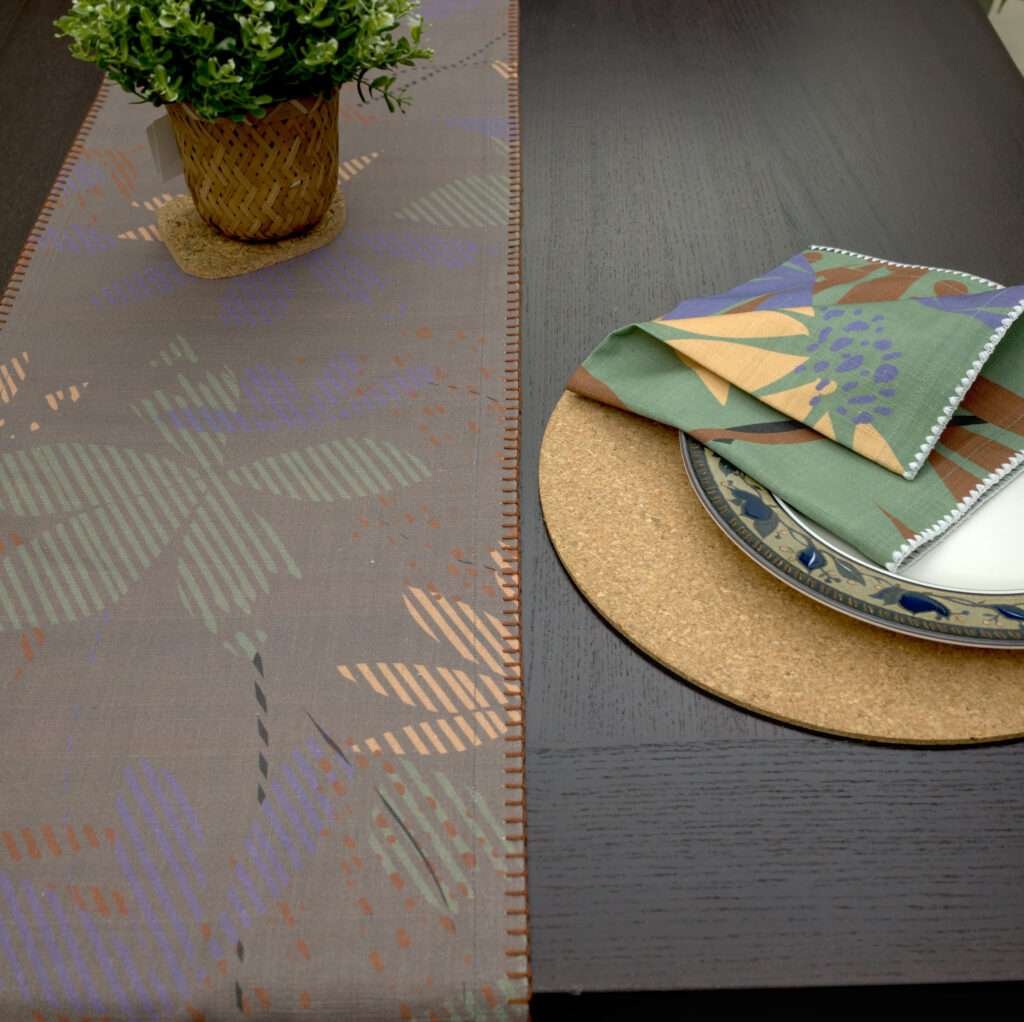 Pollen up design Dinner Napkin in purple with dark table runner LS from hem and tassel