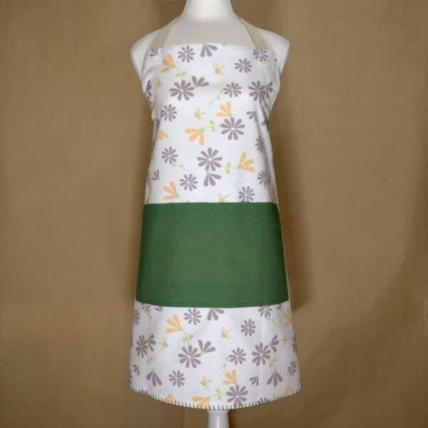 Shy dragonfly design apron with buff and grey flowers on mannequin from hem and tassel