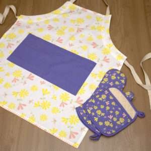 Shy dragonfly design apron with yellow flowers flat from hem and tassel
