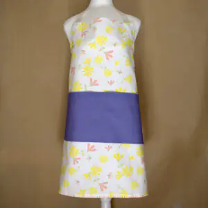 Shy dragonflies design apron with yellow flowers on mannequin from hem and tassel