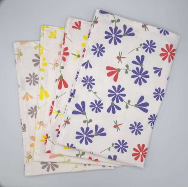 Shy dragonfly flowers design four tea towels stacked and fanned rom hem and tassel