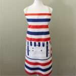 apron on mannequin in stars and stripes design from hem and tassel