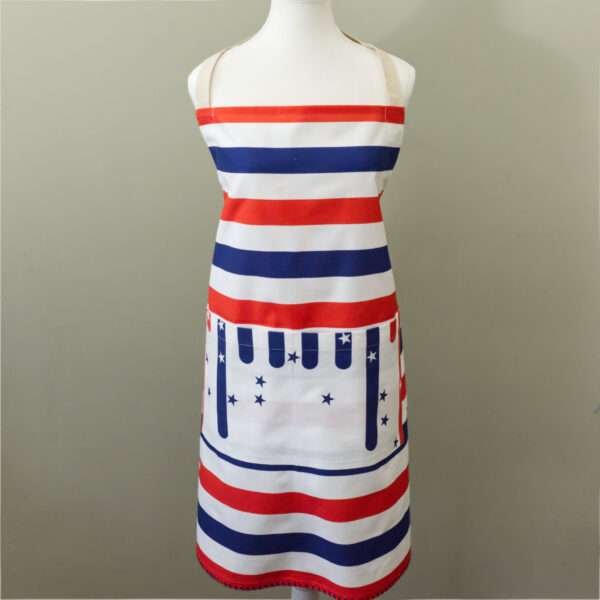 apron on mannequin in stars and stripes design from hem and tassel