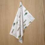 clouds and cactus design hanging tea towel from hem and tassel