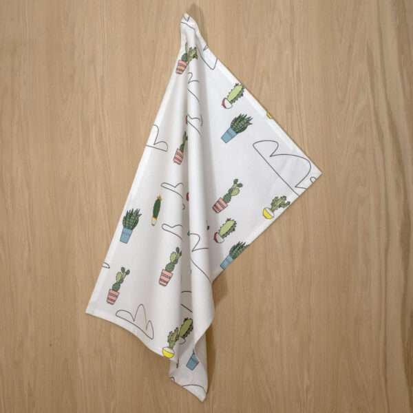 clouds and cactus design hanging tea towel from hem and tassel